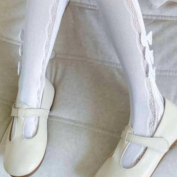 Rajstopy ażurowe z kokardką dziewczęce biały Kidodido K2316-1-15425